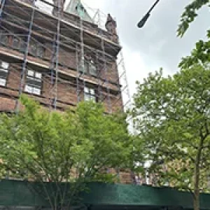 Fire Escape Repair Services for NYC Property Owners 7 Fire escape repair contractors NYC performing structural work with scaffolding